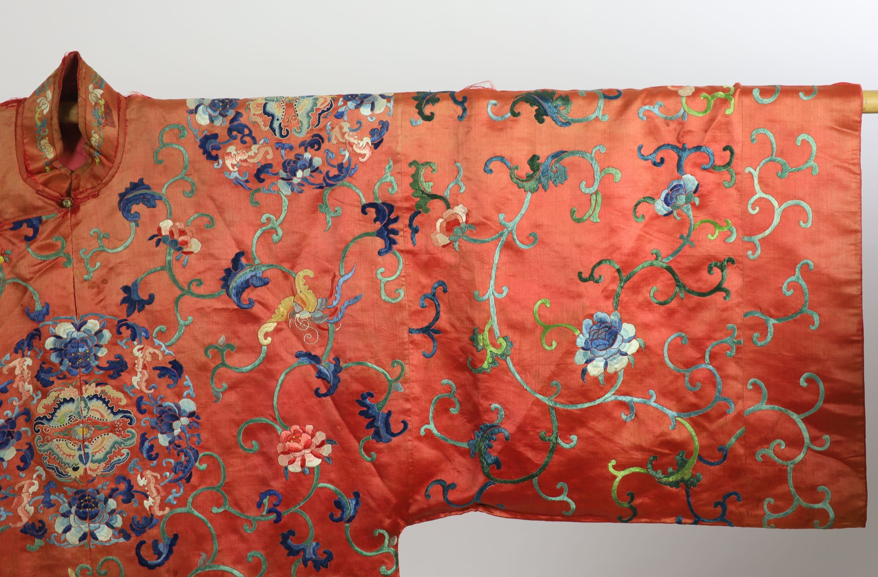 A Chinese apricot silk robe, mid 19th century, 125 cm long, wear to back of collar